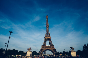 Eiffel Tower against cloudy sky