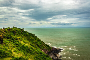 mountain cliff view with sea shore at morning