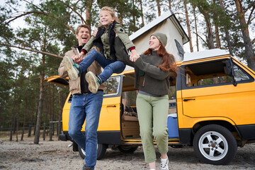 Girl having fun with his parents