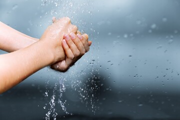 Fototapeta premium Human washing hands in clean water