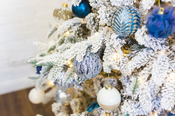 Christmas-tree decorations on a christmas fir-tree. Holidays and decor concept.