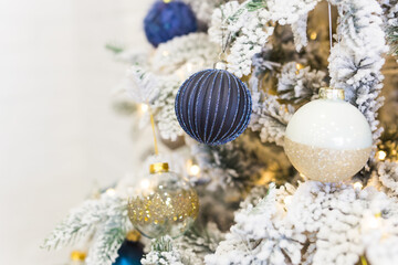 Christmas-tree decorations on a christmas fir-tree. Holidays and decor concept.