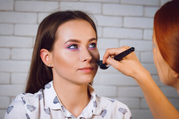 the process of gentle makeup for a beautiful girl photo series