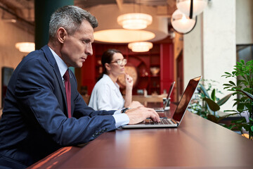 Waist up portrait of advisor and his assistant