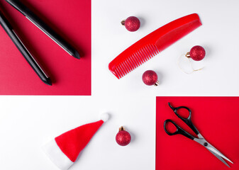 Christmas hairdresser flat lay in red and white. Red comb, baubles, santa hat, scissors and hair straightener. New Year background for hairdressing salon 
