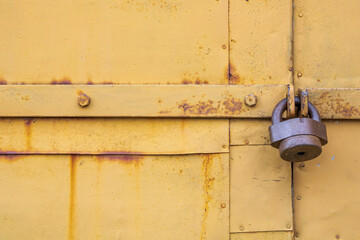 Old door with an old lock. Old padlock.