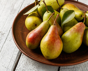 ripe organic pears on a rustic table