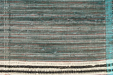 Multi Colored textile homespun rug. Folk nation creativity. Closeup.