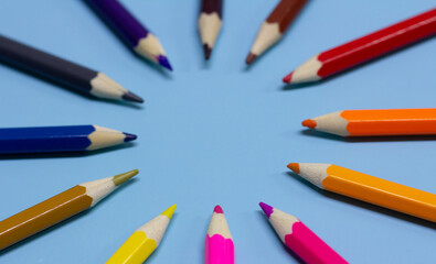 Fototapeta premium colored pencils on a blue background