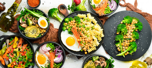 Assortment of food on white wooden background. Seafood, meat and vegetables.