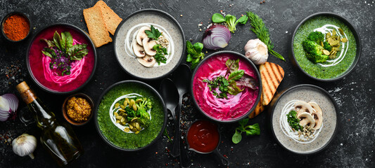 Vegetarian set of soups. Beet soup, broccoli cream soup and mushroom soup. Top view. Free space for...