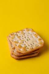 biscuit cracker on yellow background.