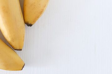Bright bunch of bananas on a white background, copy space