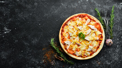 Traditional pizza with chicken, pineapple and corn. Top view. free space for your text. Rustic style.