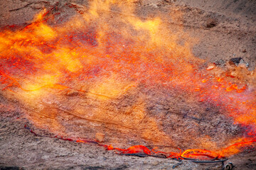 high-temperature flame center, stone melting, lava background