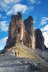 Hikers on the mountain path near the Tre Cime di Lavaredo, a UNESCO World Heritage Site.