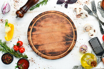 Food background. Spices, herbs and kitchen tools. Top view. free space for your text. Rustic style.