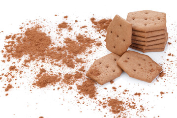 Sweet crackers with cocoa isolated on white background. Cracker sprinkled with cocoa. Close-up. There is free space for your text or sign.