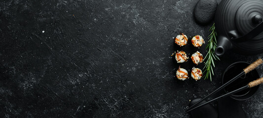 Sushi maki with eel, rice and Unagi sauce. Japanese food set. Top view © Yaruniv-Studio