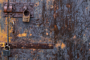 Old door with an old lock. Old padlock.