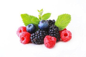 Mix berries with leaf of mint over white background