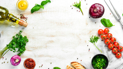 Food background. Vegetables, spices and kitchen utensils on the old table. Free copy space.