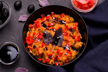 Vegetarian food concept. Soy meat with vegetables and basil on a black background.