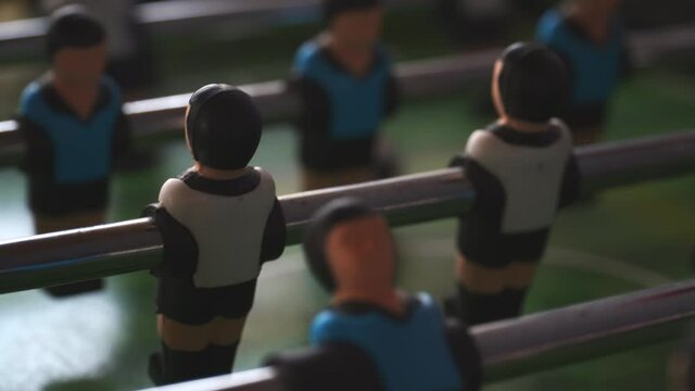 a close up of the players of a foosball table