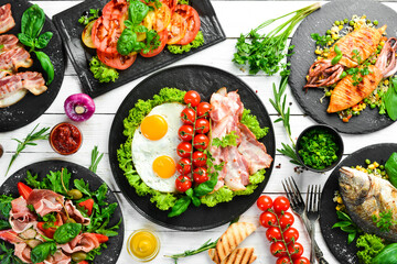 Food. Set of dishes on the white table. Food background. Top view. Free copy space.