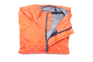 Folded orange zipper windbreaker jacket, rain proof and waterproof hiking Gore-Tex jacket hoodie....