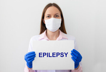 Doctor with word Epilepsy on paper board. Medical concept