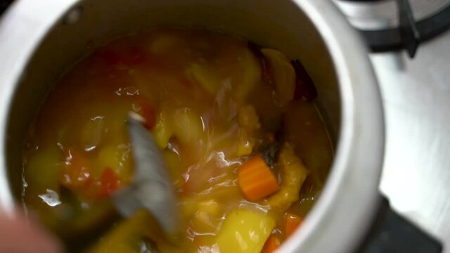 Pouring Some Cream In A Dish On The Pot To Make It Thicker And Creamier. - Close Up Shot