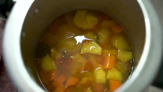 Removing The Lid Of A Pressure Cooker With Dish Inside. - High Angle Shot