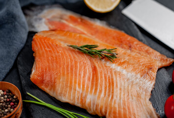 cold smoked salmon on a stone background