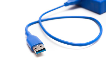 Blue external hard drive 2 terabytes with usb 3.0 port and micro-b wire for computer data storage backup isolated on white background.