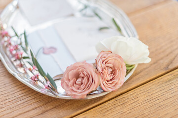 Wedding invitation card on the wooden table close up