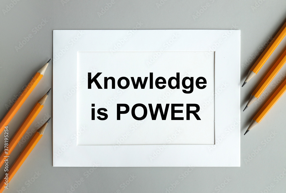 Poster knowledge is power. text on white paper in white frame on gray background