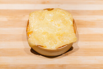 Delicious traditional German cheese close-up during cooking. To make a cheese