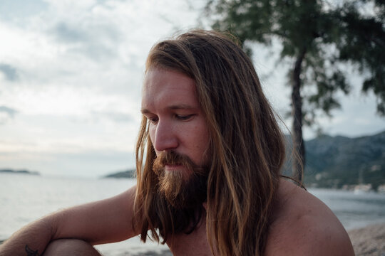 Man with long hair and beard