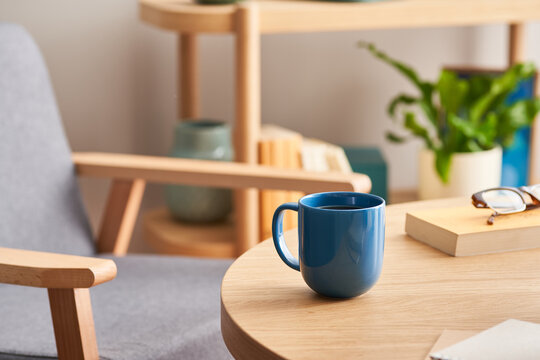 Hot beverage near book on table