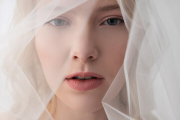 Gorgeous young woman wearing beautiful white veil