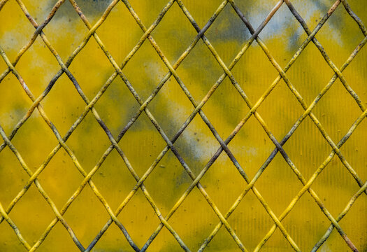 Close up of spray painted chain-link fence