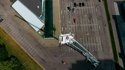 The tallest and largest mobile truck crane with extended boom, aerial top view.