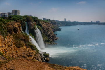 Naklejka premium Duden lower waterfalls cascade in the sea at Antalya, Turkey. July 2020, long exposure picture