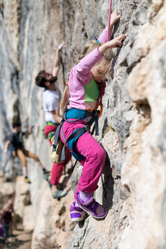 Different age group of friends rock climbing