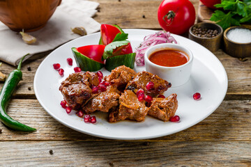skewers of mutton flesh on old wooden table