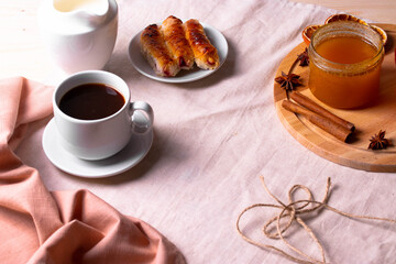 a ceramic cup of coffee and honey treats