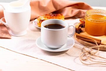 a ceramic cup of coffee and honey treats