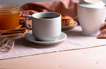 a ceramic cup of coffee and honey treats