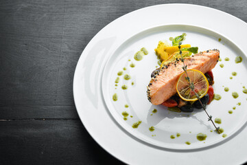 Baked salmon fillet with sesame and vegetables. Dishes, food. Top view. Free space for your text.
